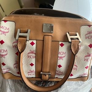 Pre loved Mcm small Drs bag in pink and white color
